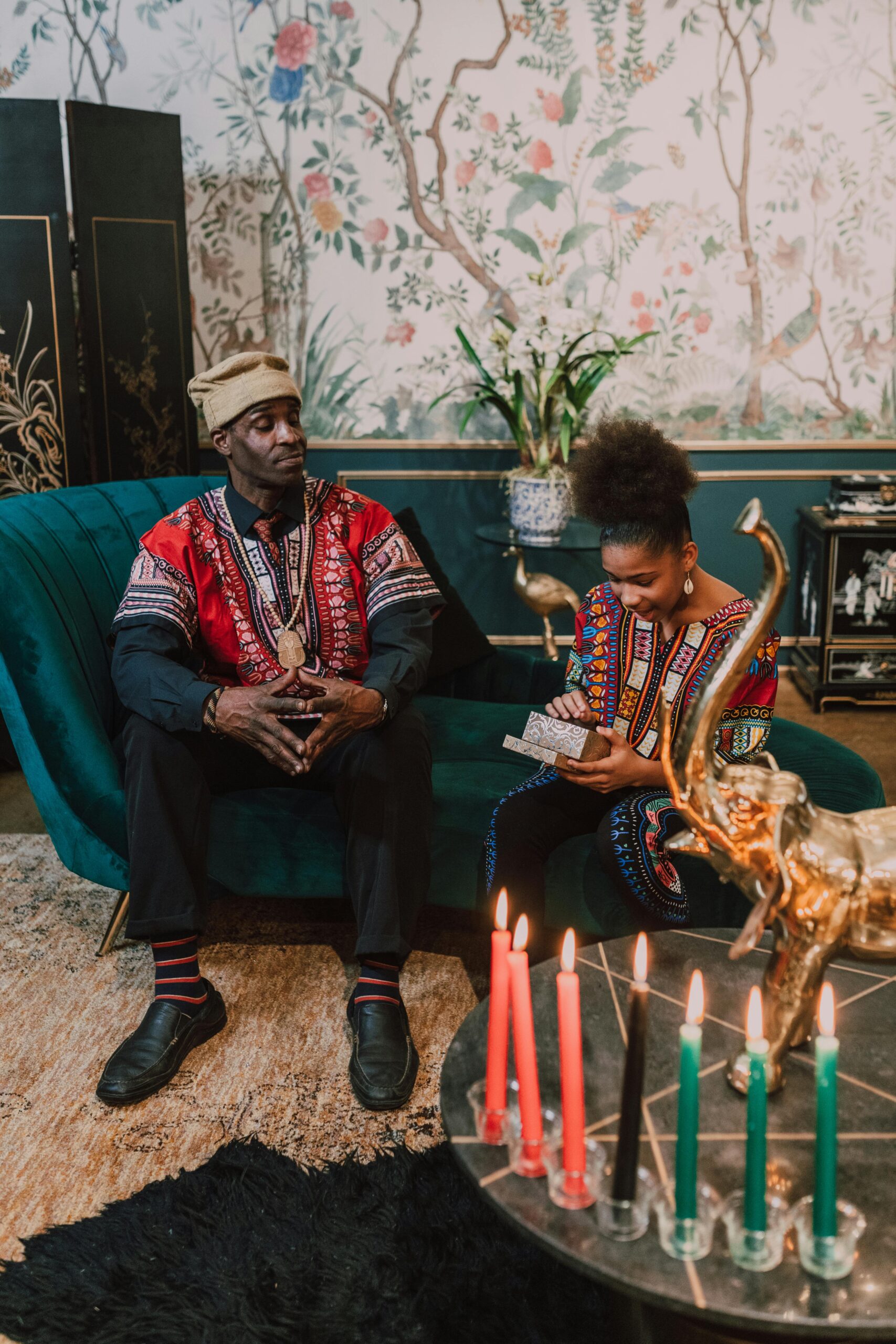 African American father and child celebrating Kwanzaa at home